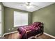 Cozy bedroom with a quilt-covered bed and neutral walls at 11531 E Lovejoy Rd, Hampton, GA 30228