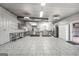 Large commercial kitchen with stainless steel appliances, ample counter space, and tile floors is ready for use at 11531 E Lovejoy Rd, Hampton, GA 30228