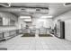 A fully equipped commercial kitchen featuring stainless steel appliances, spacious layout, and easy-to-clean tile flooring at 11531 E Lovejoy Rd, Hampton, GA 30228