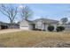 Charming home with a landscaped front yard and attached garage at 11531 E Lovejoy Rd, Hampton, GA 30228