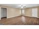 Spacious living room with wood-look floors, ceiling fan, and natural light at 11531 E Lovejoy Rd, Hampton, GA 30228