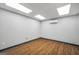 Bright office space with modern lighting, laminate wood flooring, and mini split system provides an efficient workspace at 11531 E Lovejoy Rd, Hampton, GA 30228