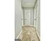 Hallway with neutral walls, carpet, and white doors creates a clean and bright path through the home at 1309 Lakeview Nw Dr, Conyers, GA 30012