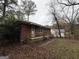 Brick home with a small front porch and landscaping at 392 Carey Se Dr, Atlanta, GA 30315