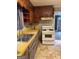 Kitchen with wood cabinetry, laminate countertops, and laminate flooring at 392 Carey Se Dr, Atlanta, GA 30315