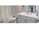 This is a well-lit bathroom featuring a shower-tub combo with white subway tile and a modern single sink vanity at 3157 Oakdale Rd, Hapeville, GA 30354