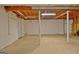 Large unfinished basement with concrete floor, ideal for storage or potential living space at 200 Deer Forest Trl, Fayetteville, GA 30214