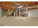 Expansive basement with exposed ceiling, concrete flooring, and ample storage space at 200 Deer Forest Trl, Fayetteville, GA 30214