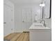 Bathroom featuring double sink vanity with modern fixtures and white cabinets at 200 Deer Forest Trl, Fayetteville, GA 30214