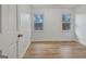 Bedroom with two windows letting in natural light and wood-look flooring at 200 Deer Forest Trl, Fayetteville, GA 30214