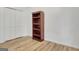 Bedroom with hardwood floors, white walls and trim, bookshelf and closet with bi-fold doors at 200 Deer Forest Trl, Fayetteville, GA 30214