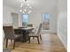 Dining area showcases wood-look floors and a stylish lighting fixture at 200 Deer Forest Trl, Fayetteville, GA 30214