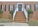 Brick steps leading to the front door with a wreath, framed by black shutters at 200 Deer Forest Trl, Fayetteville, GA 30214