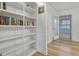 Bright hallway with open shelving and wood floors at 200 Deer Forest Trl, Fayetteville, GA 30214