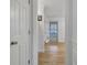 Hallway featuring wood floors and white trim at 200 Deer Forest Trl, Fayetteville, GA 30214