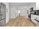 Open-concept kitchen featuring stainless steel appliances and white cabinets at 200 Deer Forest Trl, Fayetteville, GA 30214