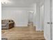 Spacious living room featuring hardwood floors, white trim, and decorative wall moulding at 200 Deer Forest Trl, Fayetteville, GA 30214