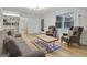 Bright living room featuring a brick fireplace, hardwood floors, and natural light at 200 Deer Forest Trl, Fayetteville, GA 30214