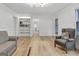 Light-filled living room featuring hardwood floors and built-in bookcase at 200 Deer Forest Trl, Fayetteville, GA 30214