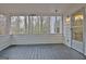 This is a covered, screened porch with a view of the surrounding trees at 200 Deer Forest Trl, Fayetteville, GA 30214