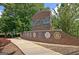 A Fayetteville welcome sign made of red brick in front of some trees at 200 Deer Forest Trl, Fayetteville, GA 30214