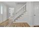 Staircase features white trim and leads to a doorway with natural light at 200 Deer Forest Trl, Fayetteville, GA 30214