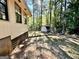 Backyard view of the home featuring trees and a storage shed at 1327 Highway 54 E, Fayetteville, GA 30214