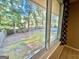 View from inside of the house that shows the fenced in backyard with large shade trees at 1327 Highway 54 E, Fayetteville, GA 30214