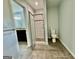 Bathroom featuring a shower with glass door and tiled floor at 1327 Highway 54 E, Fayetteville, GA 30214