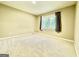 Carpeted bedroom with a window and light walls at 1327 Highway 54 E, Fayetteville, GA 30214