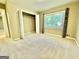 Bedroom with a window and spacious closet at 1327 Highway 54 E, Fayetteville, GA 30214