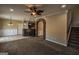 Spacious living area that features an archway and access to the kitchen and stairway at 3028 Hallman Cir, Marietta, GA 30064
