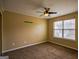 This bedroom has neutral paint, carpet flooring, a ceiling fan, and a window providing plenty of natural light at 3028 Hallman Cir, Marietta, GA 30064