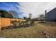 Spacious backyard features mature landscaping, a stone garden, and a wooden fence providing privacy at 3028 Hallman Cir, Marietta, GA 30064