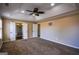 Main bedroom with tray ceiling, fan, and doorways to en-suite bath and closet at 3028 Hallman Cir, Marietta, GA 30064
