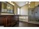 Bathroom featuring a double vanity, soaking tub, and glass enclosed shower at 3028 Hallman Cir, Marietta, GA 30064