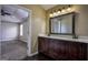 Bathroom featuring double sinks with granite counters and a large mirror at 3028 Hallman Cir, Marietta, GA 30064