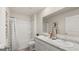 Bright bathroom featuring a double sink vanity, granite countertop, and a shower over tub with white tile surround at 564 Whitman Ln # 2017, Stockbridge, GA 30281