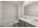 Modern bathroom featuring a double sink vanity, shower, and bathtub combo, designed for both comfort and convenience at 564 Whitman Ln # 2017, Stockbridge, GA 30281