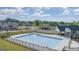 Beautiful aerial view of a community pool surrounded by a fence and community homes at 564 Whitman Ln # 2017, Stockbridge, GA 30281