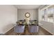 Chic dining room with modern table set, stylish chairs, and a large window at 564 Whitman Ln # 2017, Stockbridge, GA 30281