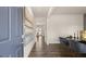 Inviting foyer featuring modern decor, hardwood floors and a view of the dining room at 564 Whitman Ln # 2017, Stockbridge, GA 30281