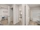Hallway view showing doors to the laundry room, bedroom, and bathroom, enhancing flow and functionality at 564 Whitman Ln # 2017, Stockbridge, GA 30281