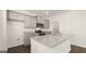 Well-lit kitchen featuring granite countertops, gray cabinets, and stainless steel appliances at 564 Whitman Ln # 2017, Stockbridge, GA 30281