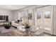 Living room features a glass table, lots of natural light, and a cozy sofa, perfect for entertaining at 564 Whitman Ln # 2017, Stockbridge, GA 30281