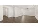 Open-concept living room with hardwood floors and multiple entry points at 564 Whitman Ln # 2017, Stockbridge, GA 30281
