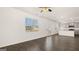 Open concept living room with hardwood floors, island and stainless steel appliances at 564 Whitman Ln # 2017, Stockbridge, GA 30281