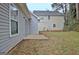 View of the backyard showing the home's exterior and yard space at 118 S Fairfield Dr, Peachtree City, GA 30269