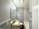 Well-lit bathroom featuring a granite vanity and tiled shower at 1779 Rosewood Rd, Decatur, GA 30032