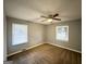 Cozy bedroom with neutral carpet, ceiling fan, and natural light at 1779 Rosewood Rd, Decatur, GA 30032